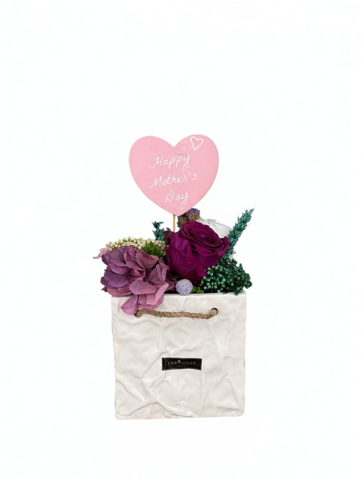 Esor Atelier Maya preserved floral arrangement featuring colorful, delicate dried flowers in a natural display.