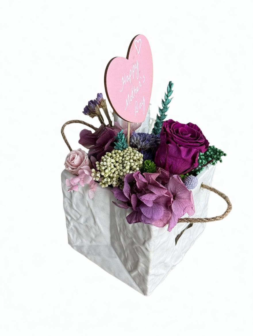 Preserved floral arrangement named Maya from Esor Atelier, featuring vibrant, long-lasting dried flowers in a stylish display.