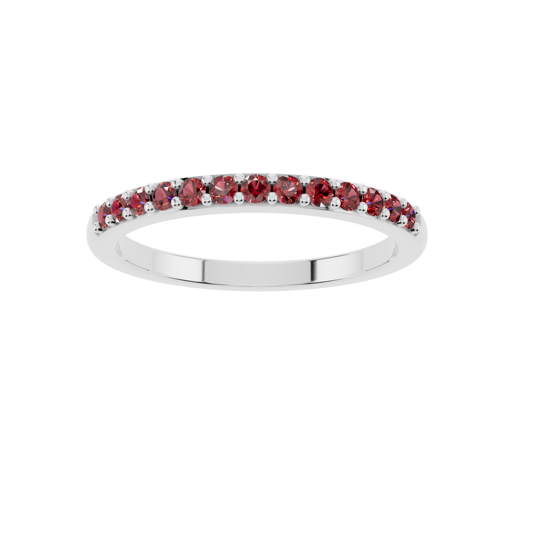 Elegant silver jewelry ring with a central ruby gemstone from Esor Atelier, showcased against a neutral background.