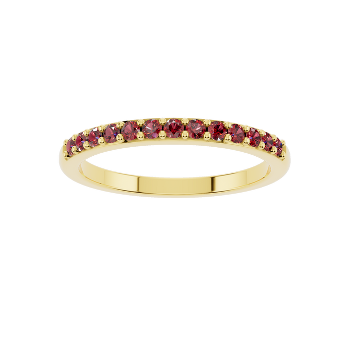 Gold jewelry ring with a ruby gemstone from Esor Atelier, showcasing a close-up of the elegant design and shiny finish.