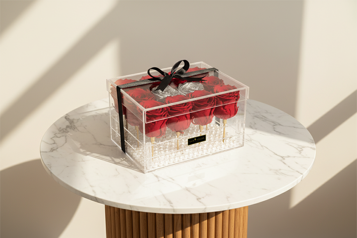 Eternal rose named Zoë by ESOR ATELIER, featuring a beautifully preserved crystal-clear rose blossom in a sleek display.