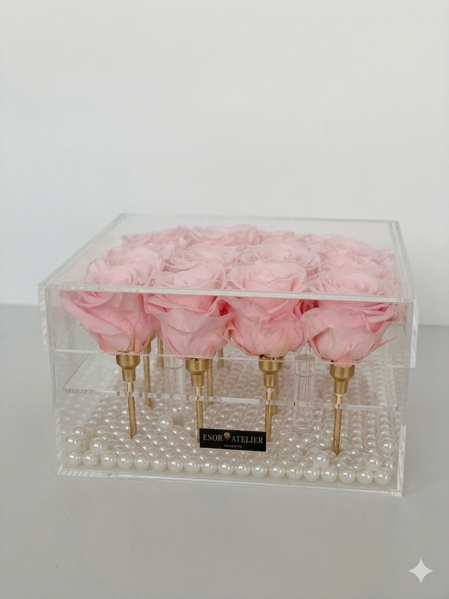 Eternal rose named Léa by ESOR ATELIER, displayed in a natural setting with soft lighting highlighting its delicate petals.