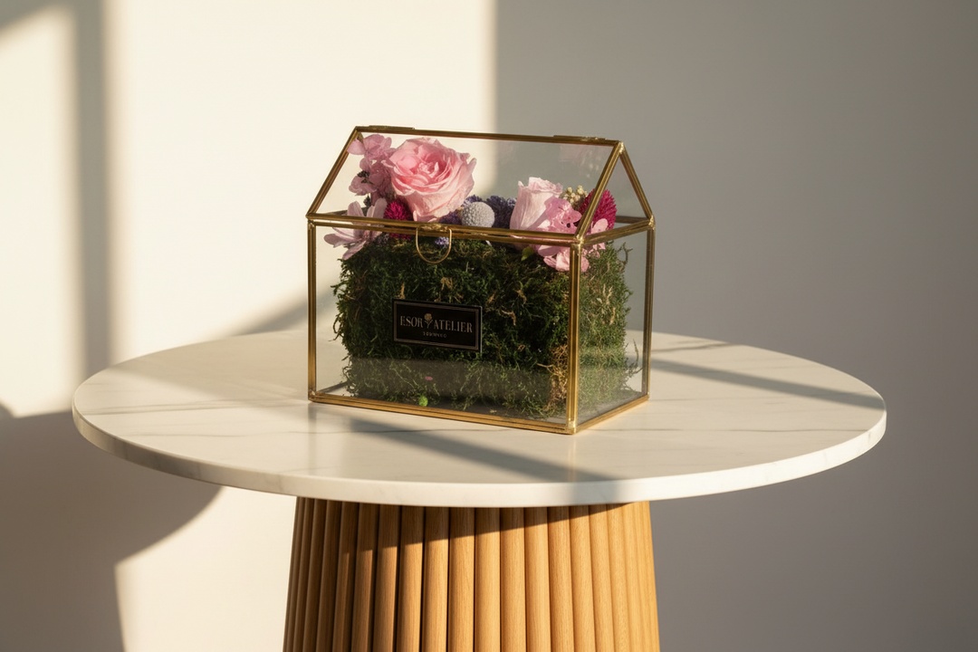 Esor Atelier Iris terrarium with lush green plants in a clear glass container, showcasing a decorative indoor plant display.