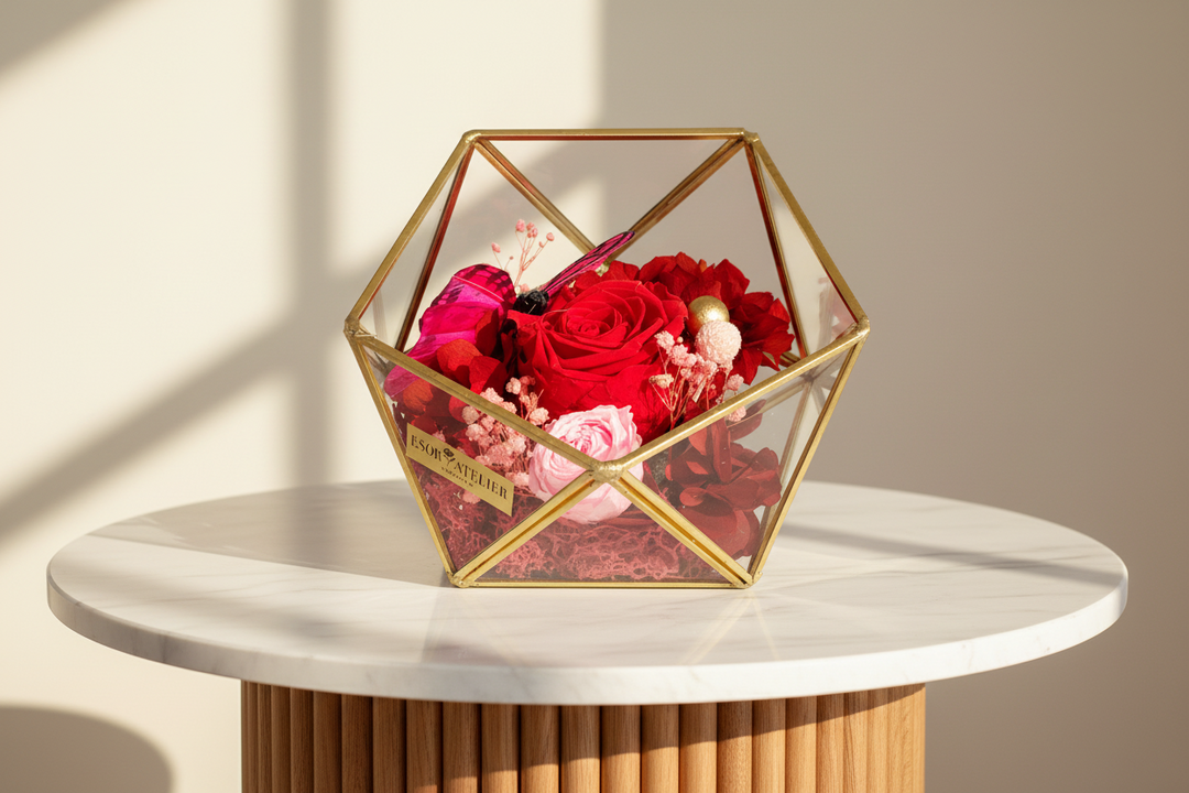 Eternal rose named Patrice by Esor Atelier, featuring vibrant, preserved rose blossoms in a decorative display.
