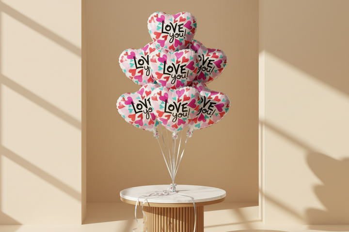 Colorful helium balloon by Esor Atelier floating against a bright blue sky, perfect for celebrations and events.