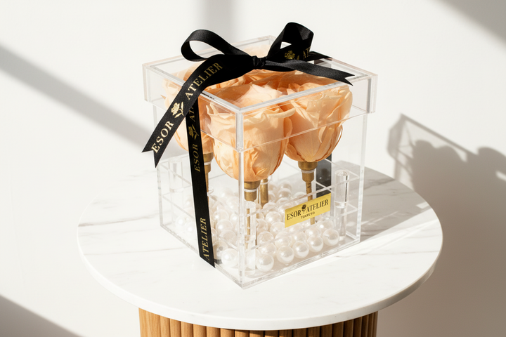 Eternal Aurora rose by ESOR ATELIER, preserved in a glass dome with delicate petals and elegant presentation.
