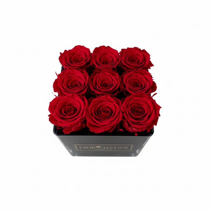 Elegant Alexandrine flower arrangement by Esor Atelier featuring vibrant blooms and lush greenery in a decorative vase.