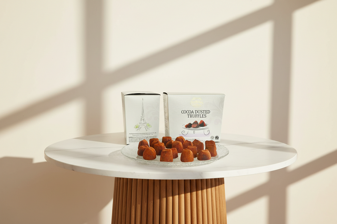 Assorted Truffettes de France chocolate French truffles with smooth, glossy dark chocolate coating and rich filling.