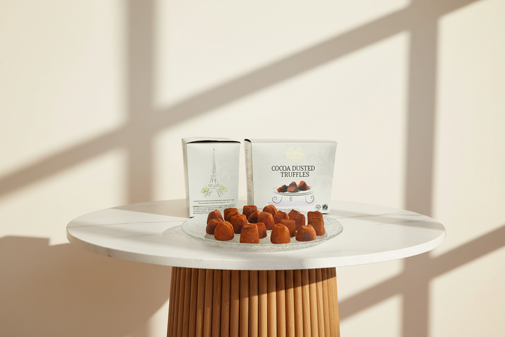 Assorted Truffettes de France chocolate French truffles with smooth, glossy dark chocolate coating and rich filling.