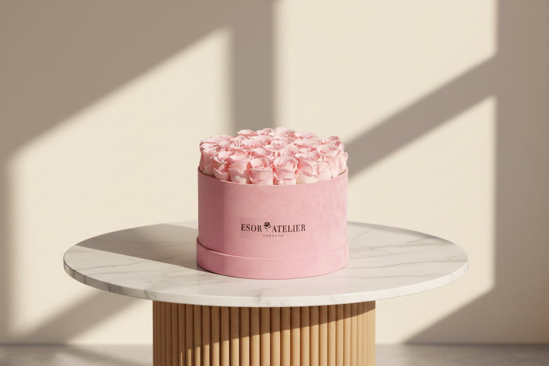 Eternal rose by ESOR ATELIER with delicate petals in a glass dome, showcasing timeless elegance and intricate craftsmanship.