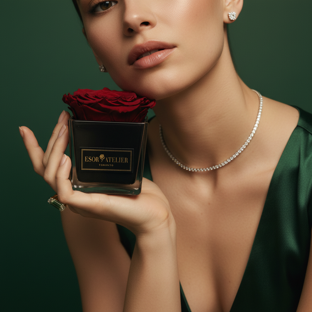 Eternal rose named Danielle by Esor Atelier, preserved in a clear glass dome with delicate petals and lush green leaves.