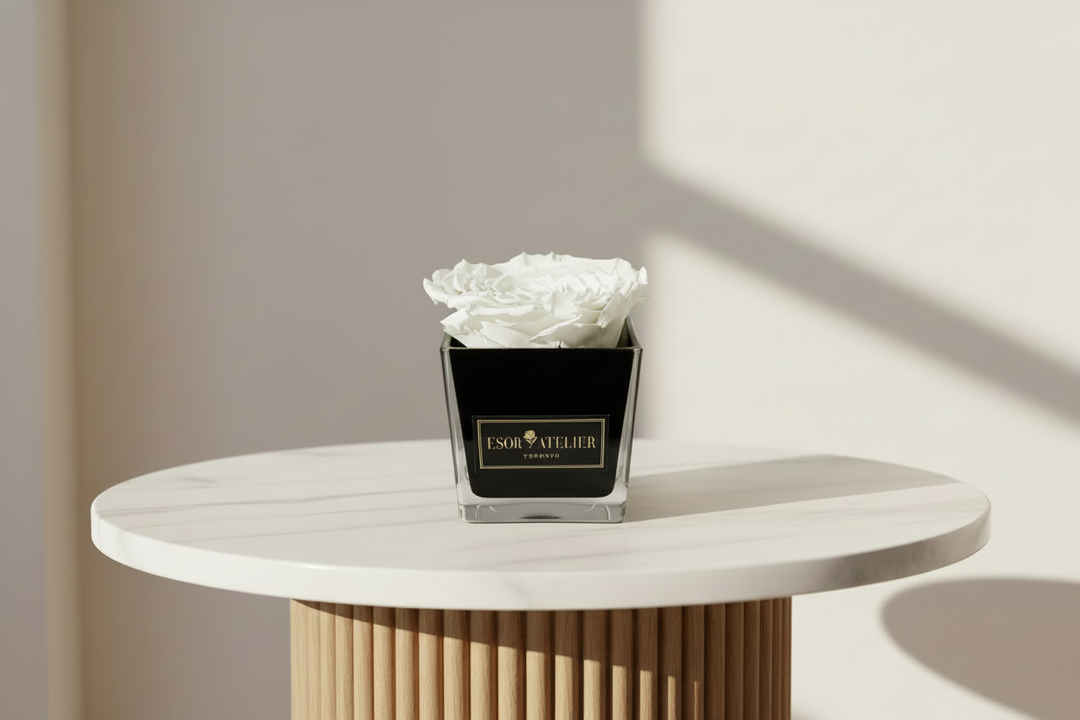 Eternal rose named Danielle from Esor Atelier, featuring a preserved, long-lasting red rose in a clear glass display.