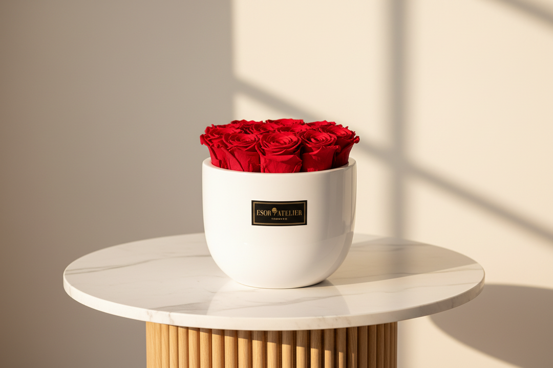 Preserved eternal rose from Esor Atelier's Paris collection, showcasing a delicate, long-lasting pink rose in a clear glass display.