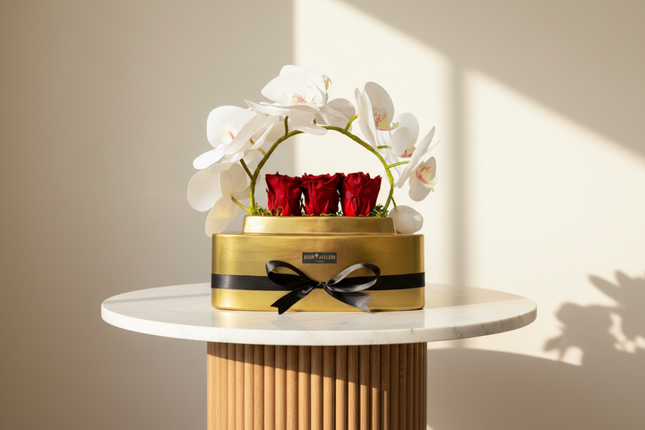 Eternal rose named Victoria from ESOR ATELIER, displayed in a clear glass dome with lush green foliage and delicate petals.